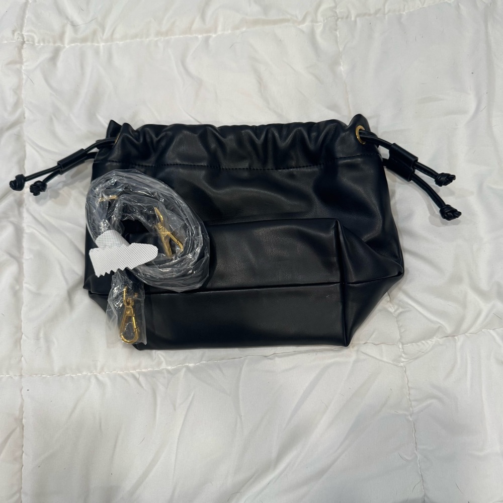 Black Melie Bianco vegan leather bucket bag with detachable long crossbody strap